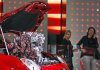 Visitors look at an Alfa Romeo on display Wednesday at the Frankfurt Auto Show in Frankfurt, Germany.