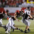 Arkansas senior safety Matt Harris moves in to try and tackle Missouri State junior quarterback Cody...