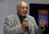 Sanford Tollette, Executive Director of Joseph Pfeifer Kiwanis Camp in Little Rock, addresses the Greater Graduation Project Summit Wednesday in Springdale. Tollette said the time to work with at-risk students is while they are in the early stages of their education.