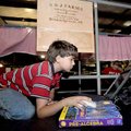  Joseph Brandeberry, 12, played a computer game during his downtime at the Benton County Fair on Wed...