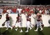 Arkansas players accept congratulations from fans after a season-opening 48-10 victory over Missouri State.
