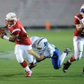 Woodland Junior High's Heath McCracken falls into the end zone as Springdale George Junior High safe...