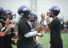 Fayetteville junior quarterback Brandon Allen, right, speaks Thursday to his offense as the Dogs' prepare for today's game against Russellville at Harmon Field.