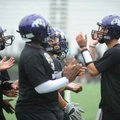 Fayetteville junior quarterback Brandon Allen, right, speaks Thursday to his offense as the Dogs' pr...