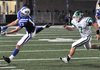 Rogers receiver Casey Caton stretched but couldn't come up with a reception in front of Van Buren's Tyler Hassell during the first half of Friday night's game at Mountie Stadium. Caton had two catches for 45 yards and a touchdown and the Mounties outscored Van Buren 20-0 in the fourth quarter to win 62-38.