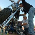 Kevin Williams, right, owner of Hawg City Choppers in Fayetteville, and friend Mike Kugler polish a ...