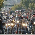 Motorcyclists wait to turn onto North College Avenue from Dickson Street while participating in the ...