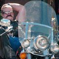A biker leans on his Harley-Davidson Heritage Softail during the fifth annual Bikes, Blues and BBQ S...