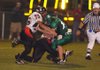 Pea Ridge junior Kirk Parmenter (75) and sophomore Ricardo Schneider (11) sack Greenland quarterback Jordan
Larkan (16) in the third quarter Friday in Greenland.