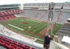Gareth Clary, with Skycam ESPN, helps install a flying support wire for the Skycam on Friday at Razorback Stadium.
The aerial camera will be used for the live broadcast of the Razorbacks' game against Georgia today on ESPN.