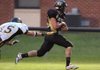 West Fork senior running back Garret Eakins (25) slips from the grasp of Prairie Grove junior Charles Stills (15) as
Eakins goes on to score a touchdown Friday in West Fork.