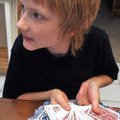 Ryan Smith, 11, of Rogers practiced a magic trick at his home with magician George Reader. Smith has...
