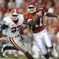 Arkansas freshman Cobi Hamilton (11) slips past Georgia junior linebacker Akeem Hebron after taking ...