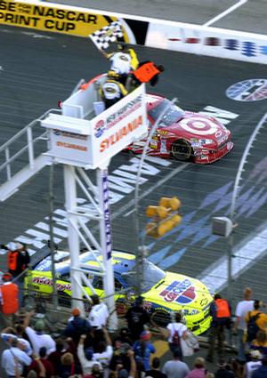 Mark Martin (5) holds off Juan Pablo Montoya to win Sunday in New Hampshire. Denny Hamlin also passed Montoya to finish second.