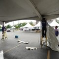 Workers with Intents Party Rentals in Fayetteville, from left, Lee Stewart, Adam Hatch and Ryan Clar...