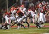  Arkansas sophomore running back Broderick Green, center, is tackled for a loss by Georgia senior defensive tackle Kade Weston, left, as junior Will linebacker Ronnie Curran (35) closes in on the play during the Hogs' 52-41 loss Saturday in Razorback Stadium. 