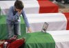 Martin Fortunato, the 7-year-old son of Lt. Antonio Fortunato, stands at his father's coffin Monday in Rome during a state funeral for six soldiers killed last week in Afghanistan.