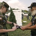 Chief Master Sgt. Malachi Eliasen, 14, of Bentonville,with the Arkansas Civil Air Patrol (left) and ...