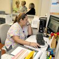 Maria Zamarripa, a health-services specialist, answered phones and made appointments during the gran...