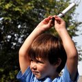 <b>Singing for peace</b>
Criston Jackson, 4, of Bella Vista, held onto the peace light after the st...