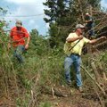 <b>Clearing a path</b>
Seven Valley Construction workers Pat Deditius, from left, Joseph Gemmecke a...