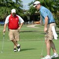 Dale Reed, right, putts in on No. 5 as partner Chad Reaves looks on Monday during the Washington Reg...