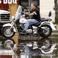Kawasaki Motors Corp. employee Dan Millholland of Maryville, Tenn., pulls demo bikes out of the trai...