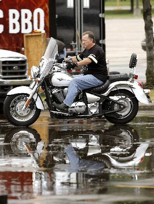 
                               
                                  Photo by Jason Ivester&mdash;
                               
                           
                           Kawasaki Motors Corp. employee Dan Millholland of Maryville, Tenn., pulls demo bikes out of the trailer and into the parking lot Tuesday outside Baum Stadium and the Randal Tyson Track Center in Fayetteville in preparation for the Bikes, Blues & BBQ Motorcycle Rally. The 10th annual event begins today (WEDNESDAY).