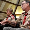 Michael Swisher, 18, of Bentonville sat with his dad, Brian, before Michael was awarded his Eagle Sc...