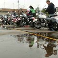 Kawasaki representatives Dan Millholland, right, and C.J. Culley gas up demo bikes Tuesday as they p...
