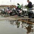 Kawasaki representatives Dan Millholland, right, and C.J. Culley gas up demo bikes Tuesday as they p...