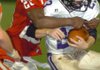 Farmington sophomore Deon Clay (26) tackles an Ozark player Friday, Sept. 11, during the first half of play at
Farmington.