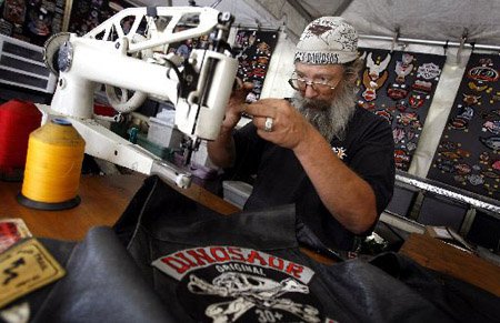 
                               
                                  Photo by Jason Ivester&mdash;
                               
                           
                           "Stitcher Gene" loads thread into his sewing machine Wednesday inside his booth along Dickson Street in Fayetteville during the 10th annual Bikes, Blues & BBQ Motorcycle Rally.