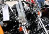 Todd White of Bentonville looked at some motorcycles that were for sale outside of Pig Trail Harley-Davidson in Rogers on Wednesday. 