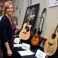 <b>Sharing and Caring</b>
Sharon Clayton and Dick Doyle, both of Dallas, Texas, looked at guitars s...