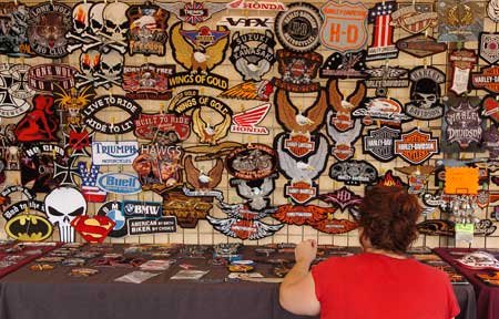 
                               
                                  Photo by Brooke McNeely&mdash;
                               
                           
                           Dianne Raica, with Cycle Patch, restocks some of the patches she sells at her booth at the Randal Tyson Track Center parking lot Wednesday during the first day of Bikes, Blues & BBQ. 

