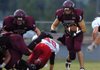 Lincoln junior Ezquiel Hernandez (23) bursts through the gap against Green Forest in the first quarter Sept. 11 in Lincoln. The Wolves lost 16-6. 