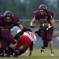 Lincoln junior Ezquiel Hernandez (23) bursts through the gap against Green Forest in the first quart...