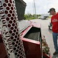 Grant Loyd of Siloam Springs and the Smokin' Jokers explains his team's smoker in the parking lot ac...
