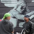 A photo on the trailer of SuckerPunch Sallys looks over customers in the parking lot of Baum Stadium...