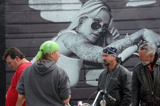 
                               
                                  Photo by William Moore&mdash;
                               
                           
                           A photo on the trailer of SuckerPunch Sallys looks over customers in the parking lot of Baum Stadium during Bikes, Blues and BBQ Thursday, September 24, 2009 in Fayetteville.