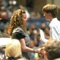 Springdale Har-Ber senior Robert Taylor Reed shakes the hand of Mrs. Bonnie Culp as he is presented ...