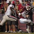 Arkansas wide receiver Greg Childs (right) scores a touchdown in Saturday's 52-41 loss to Georgia. C...