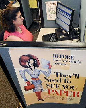 Rebecca Schor applies for benefits in August at an employment office in Boston.