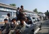 Armed members of a private militia patrol with army troops Thursday in Kanju near Mingora, the main town of Pakistan's troubled Swat Valley.