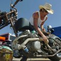 Shannon "Shoe" Gower with Hotshoe Custom Motorcycle, Inc. in Locust Grove, Oklahoma shows off one of...