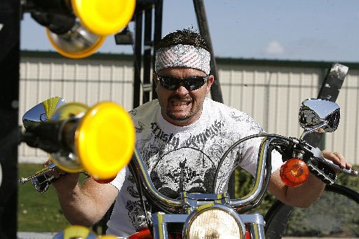 
                               
                                  Photo by Bob Coleman&mdash;
                               
                           
                           Chuck Ames of Rogers runs his motorcycle on the Geico Dyno Drag at Pig Trail Harley Davidson in Rogers Friday afternoon. Riders get to race against the clock and other riders on the stationary drag strip.