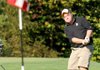 Bentonville's Ben Sullivan chipped onto the green at the second hole Friday at Bella Vista Country Club during the 7AWest Conference Golf Championships.