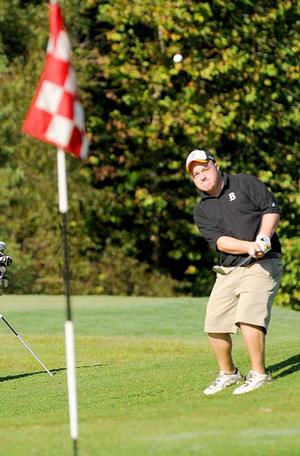 Bentonville's Ben Sullivan chipped onto the green at the second hole Friday at Bella Vista Country Club during the 7AWest Conference Golf Championships.