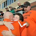 <b>Remembering Casey</b>
Gravette coach Duke Mobley, left, received a hug after presenting the game...
